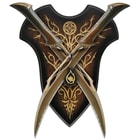The wooden wall plaque has a decorative background and notch for holding the twin daggers. 