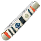 The handle scales are in bands of red, white and blue bone, accented with brass spacers, and it has an engraved blue ribbon