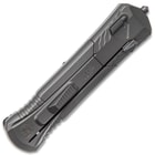 Closed dark grey pocket knife with matte finish and tactical styling featuring a glass breaking pommel on the top end. 
