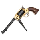 The 14 3/5” overall length black powder revolver has a brass frame and an 8” blued steel, octagon barrel
