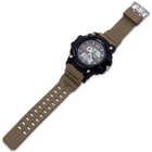 The khaki watch band is a tough polyurethane with a stainless steel buckle and strong stainless steel pins