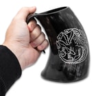 The carved mug shown in use