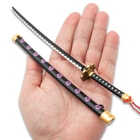 Full image of the Mini Collectible Sword held in hand.
