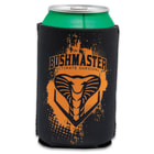 A can is shown inside a black koozie with an orange paint splatter effect on the Bushmaster logo, which features a snake head image.