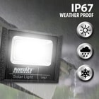 Full image of the Outdoor Solar Light 580 Lumens out in the rain displaying that it is IP67 weather proof.