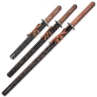 The swords come in black lacquered wooden scabbards with gold splatter-paint accents and brown cord-wrap