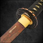 The 39 1/2” overall katana slides into a hand-lacquered, black scabbard, which features cavalry hanging hardware and cord-wrapping