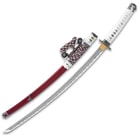 The 38” overall tachi fits securely into a maroon lacquered sheath with metal accents and an intricately wrapped sword hanger