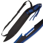 Twin sword set shown secured into a black nylon shoulder sheath and with detailed view of the blue detailing on the blade. 