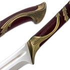 A zoomed view showing the Elven vine design of the cast metal handle. 