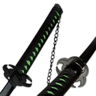 The neon green imitation ray skin of the katana handle is wrapped in black cord and has a black chain on the end. 