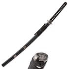 The black scabbard has traditional engravings and has a black hanging cord. 