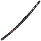 The 41” katana slides into a black lacquered wooden scabbard, accented with hand carved artwork and black cord-wrap
