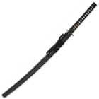 The 41 7/10” overall katana slides into its black, lacquered wooden scabbard, which has black cord-wrap accents