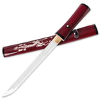 The crimson red handled tanto laid across the coordinating crimson red scabbard with mother of pearl dragon design. 