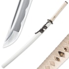 The white glossy scabbard is shown between the carbon steel blade point and ray skin handle with menuki. 