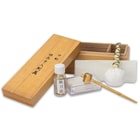 Included is a complete maintenance and cleaning kit, neatly contained in a wooden box