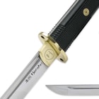 “Honshu” is printed on the blade beneath the brass tsuba. 