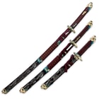 The wooden sheaths of the katana, wakizashi, and tanto have ornate designs and cord wrappings, matching the swords’ hilts