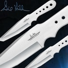 Detailed view of the three stainless steel throwing knives with “Hibben Knives” etched on the side and holes on the handles.
