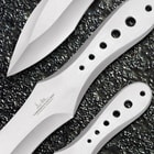 Each of the throwing knifes has holes on the handle and “Gil Hibben” signature on the blade.