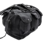 The ammo bag has large Velcro pockets on each side and three magazine pockets with drain holes on each side