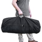 The Medium Side Zipper Duffle Bag is made of heavy-duty, black 100 percent cotton canvas with a sturdy metal zipper