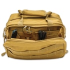 The toolkit bag has a large, main zippered compartment that contains individual slots to store tools and other gear