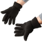 The gloves are constructed of 200g polar fleece, and the adjustable Velcro wrist strap assures that one size fits most
