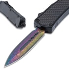 The rainbow anodized, 3 1/2” stainless steel, dagger blade can be quickly deployed with the slide trigger on the side