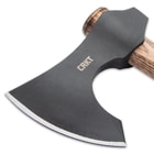 The bearded axe head has a hammer on one side and a 4 3/5”, razor-sharp blade, that’s 1 1/2” thick, on the other side