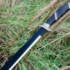 The machete has pakkawood handle inserts, steel guard, and full tang stainless steel blade with corrosion resistant black blade finish.