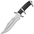 Mirror polished fighter knife with a black micarta handle with red accents and various curved edges. 
