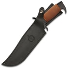 The 13 1/2" overall knife can be carried in its premium black leather belt sheath with snap strap closure.