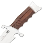 The finger-grooved handle is crafted of dark brown pakkawood and it has a chrome-plated pommel with a lanyard hole