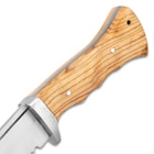 The handle scales are natural-colored wood and secured to the full tang with stainless steel pins.