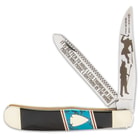 The trapper has razor-sharp stainless steel blades with black, laser-etched artwork and messages on each blade