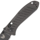 The 4 3/10” handle is made of Benchmade’s CF-Elite material and it has a deep-carry pocket clip and a lanyard hole