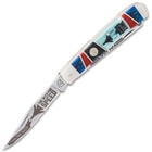 It has two razor-sharp stainless steel blades with Tomcat Fighter themed etchings, and they are protected by brass liners