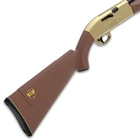 An image of the Crosman 1000 Gold edition which shows the butt stock with unique bade and gold accents of the trigger assemly and receiver. 