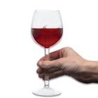Full image of Wine Glass with wine inside of it.