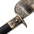 The cast metal scabbard throat has a skull and crossbones symbol just beneath the ship design on the guard. 