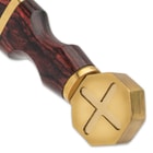 The handle is a rich, reddish wood, accented with brass bands, and it has a brass pommel in the Crusader style