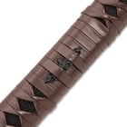 The hardwood handle has black faux rayskin and is wrapped in genuine brown leather to complement the blade