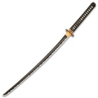The keenly sharp, 28” blade is crafted of 1060 carbon steel with a burned finish and black coating and the habaki is brass