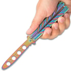 A hand is shown holding the rainbow trainer, showing the unsharpened false edge blade.