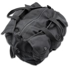It has a black, 100 percent cotton canvas construction with a hard bottom and a zippered main compartment