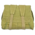 It has a heavy-duty, olive drab 100 percent cotton canvas construction with canvas and nylon webbing shoulder straps
