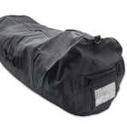 It has a tough, nylon webbing carry strap on each end and one on the side, plus, a plastic nametag holder on one end