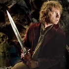 Full image of Bilbo Baggins holding the Sting Sword included in the Hobbit Bilbo Collection.